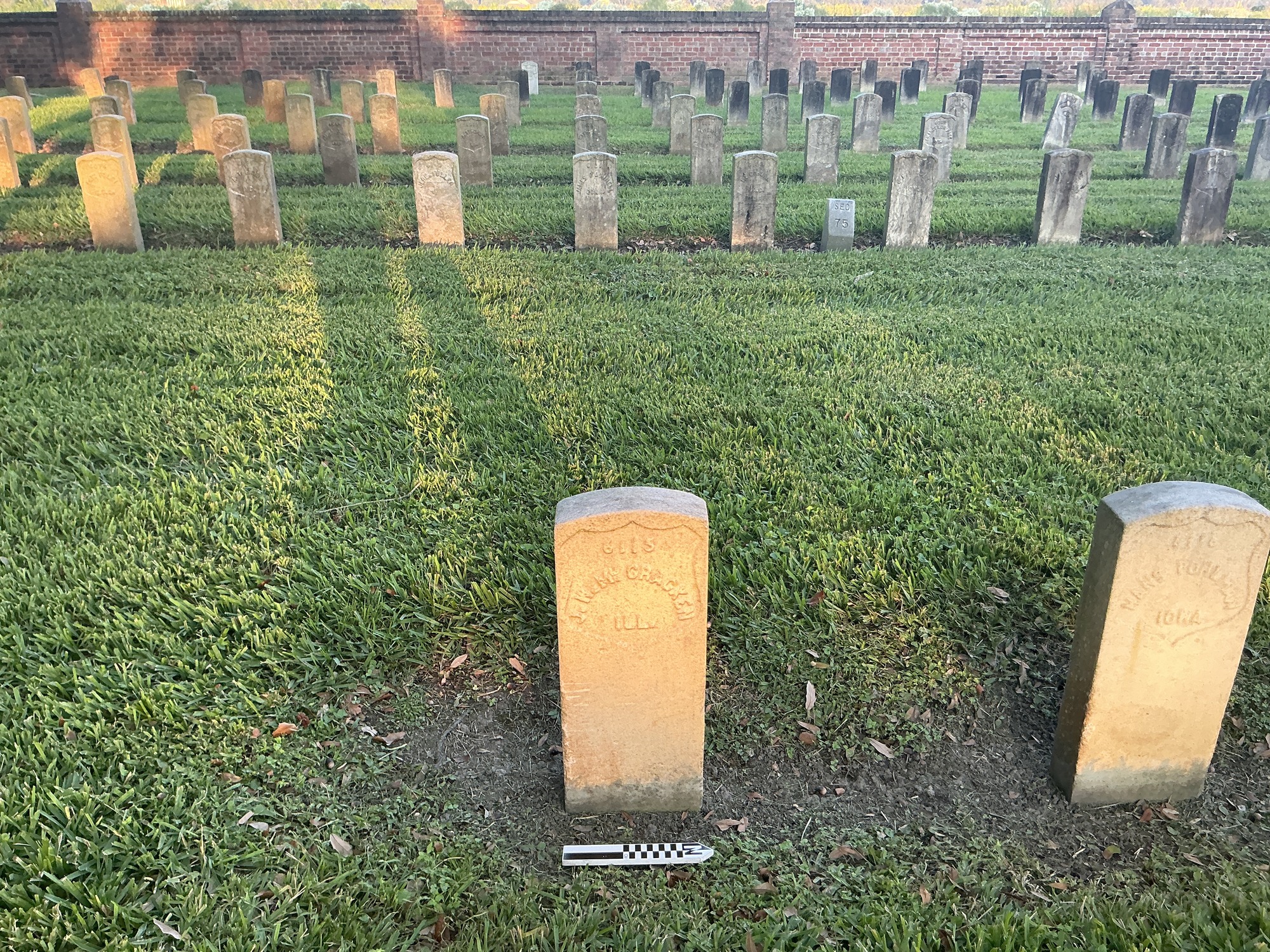Extra image of historic upright marble headstone with recessed shield face.