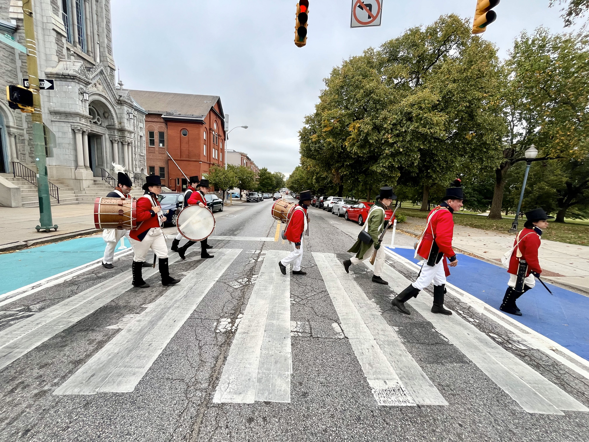 Living Historians crossing the road near Patterson Park