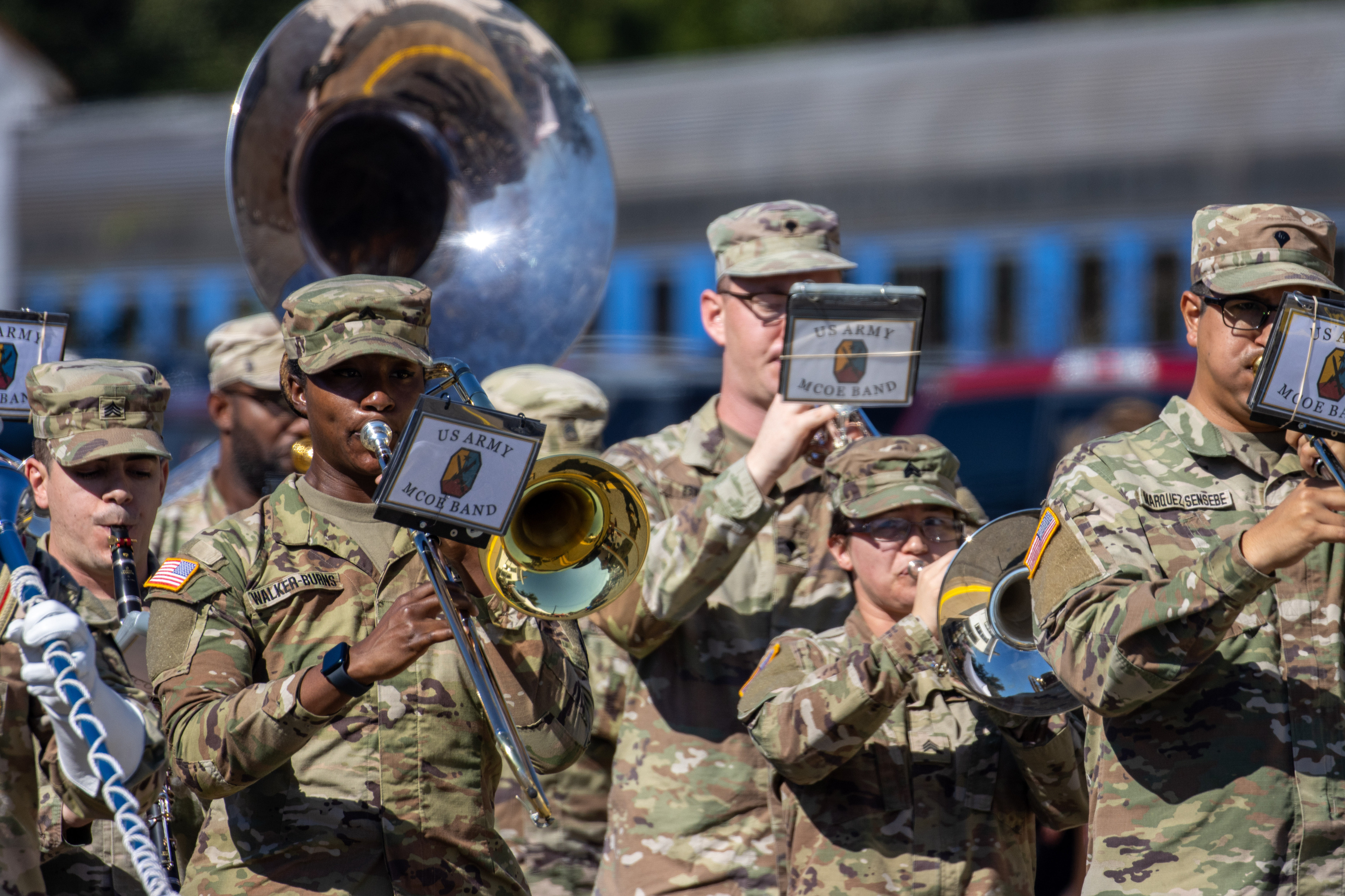 U.S. Army band walks in Plains Peanut Festival Parade playing multiple instruments. 