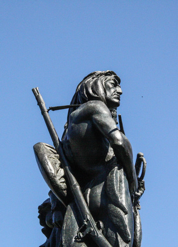 Statue of a Native American, soldier, and frontiersman