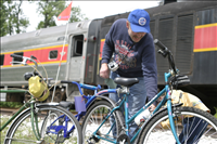 Cuyahoga Valley Scenic Railroad, Bikers Waiting to Board Train. In 2007 CVSR and NPS launched Bike Aboard!service to encourage use of the railroad as alternative transportation. For a $2 fare cyclists can ride the train in one direction and bike the other along the Ohio & Erie Canal Towpath Trail. Some images are at Rockside Station and others in Peninsula near the Peninsula Depot.