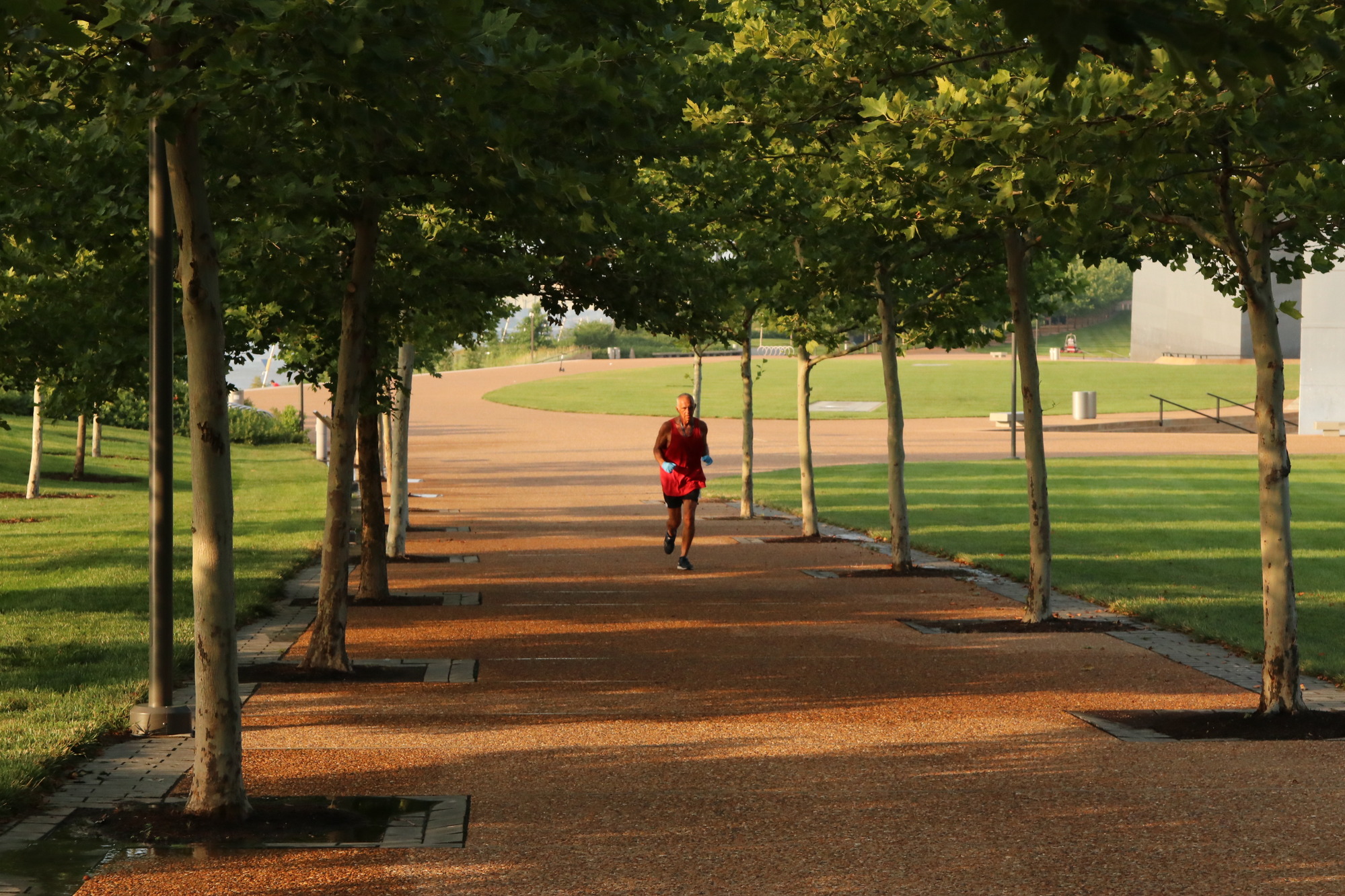 Man jogs on Arch grounds