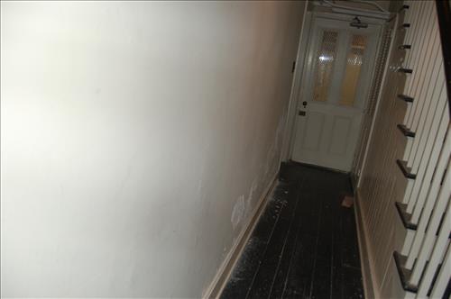 Water infiltration and damage to walls and floor of the Petersen House