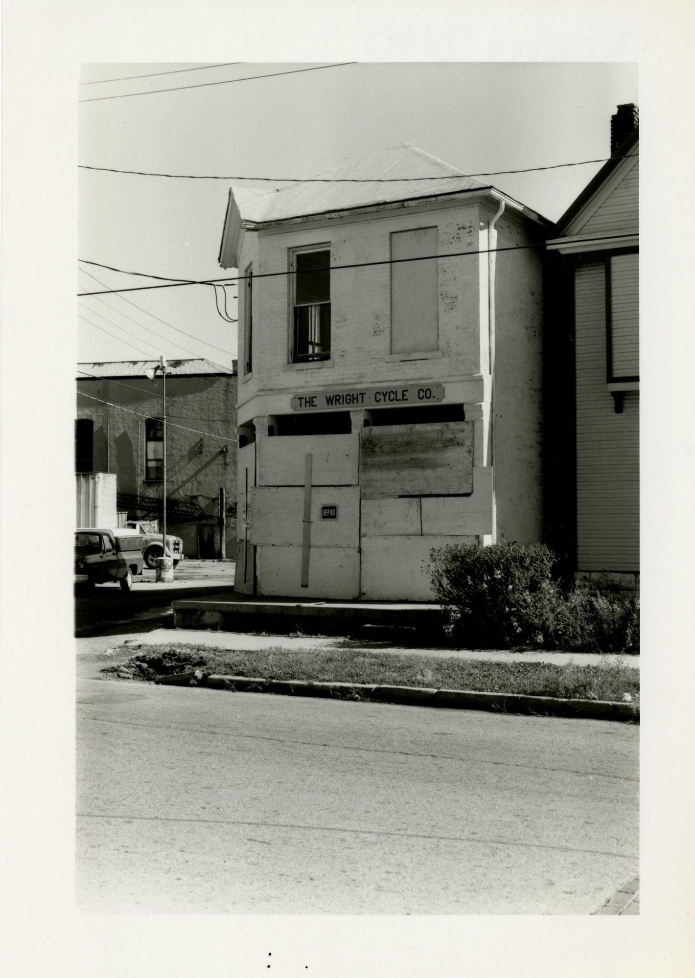 Wright Cycle Company with boarded up entrance