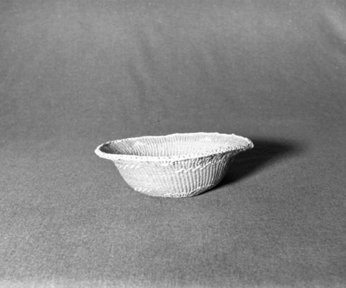 Marie Rozier Collection, Catalog No. 12. Object: Siletz basket. Dimensions: 10 x 3 1/2". Materials: Conifer root, beargrass, hazel. Technology: Last one inch worked from interior of basket. Collection History: Purchased from Berger Roos, Queen Gardens, Brooklyn. Photographed by Michael Dixon, December 1982. Catalogued by Craig Bates and Barbara Beroza. Yosemite Collections, National Park Service.