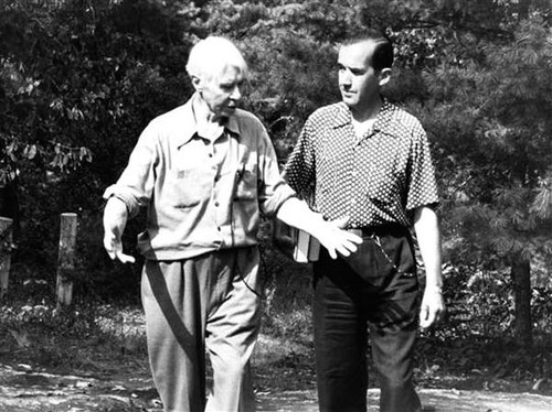 Two men walking next to each other