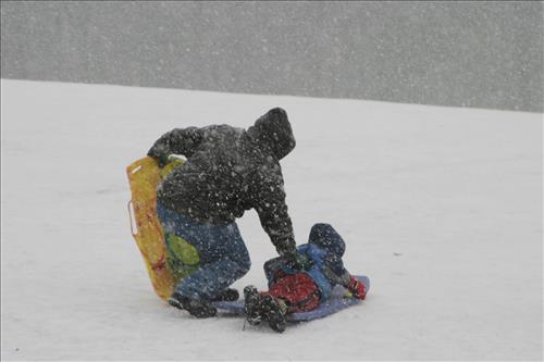 Sledding at Kendall Hills Adult and Child
