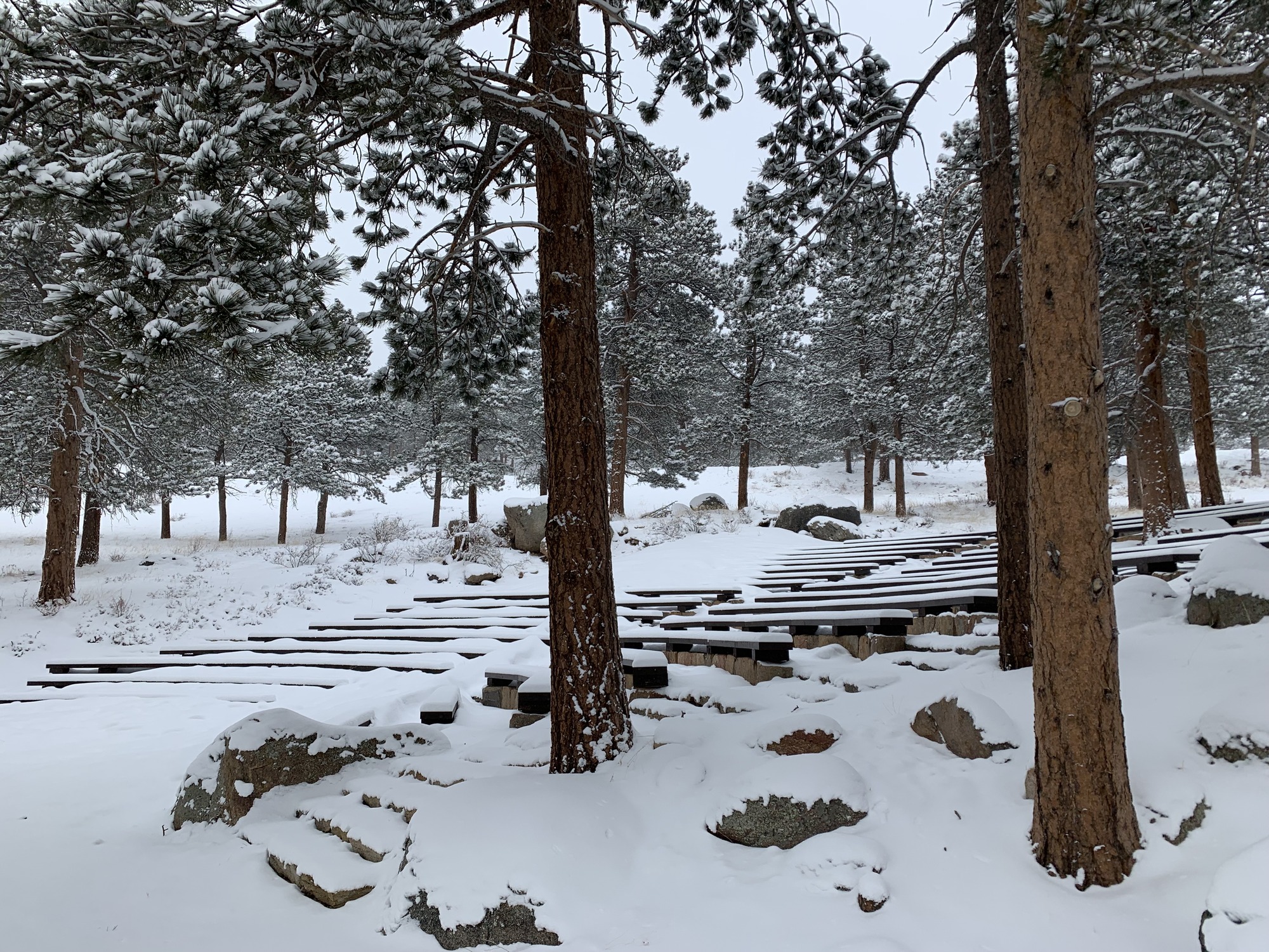 View of Moraine Park Amphitheater seating from trail entrance in February 