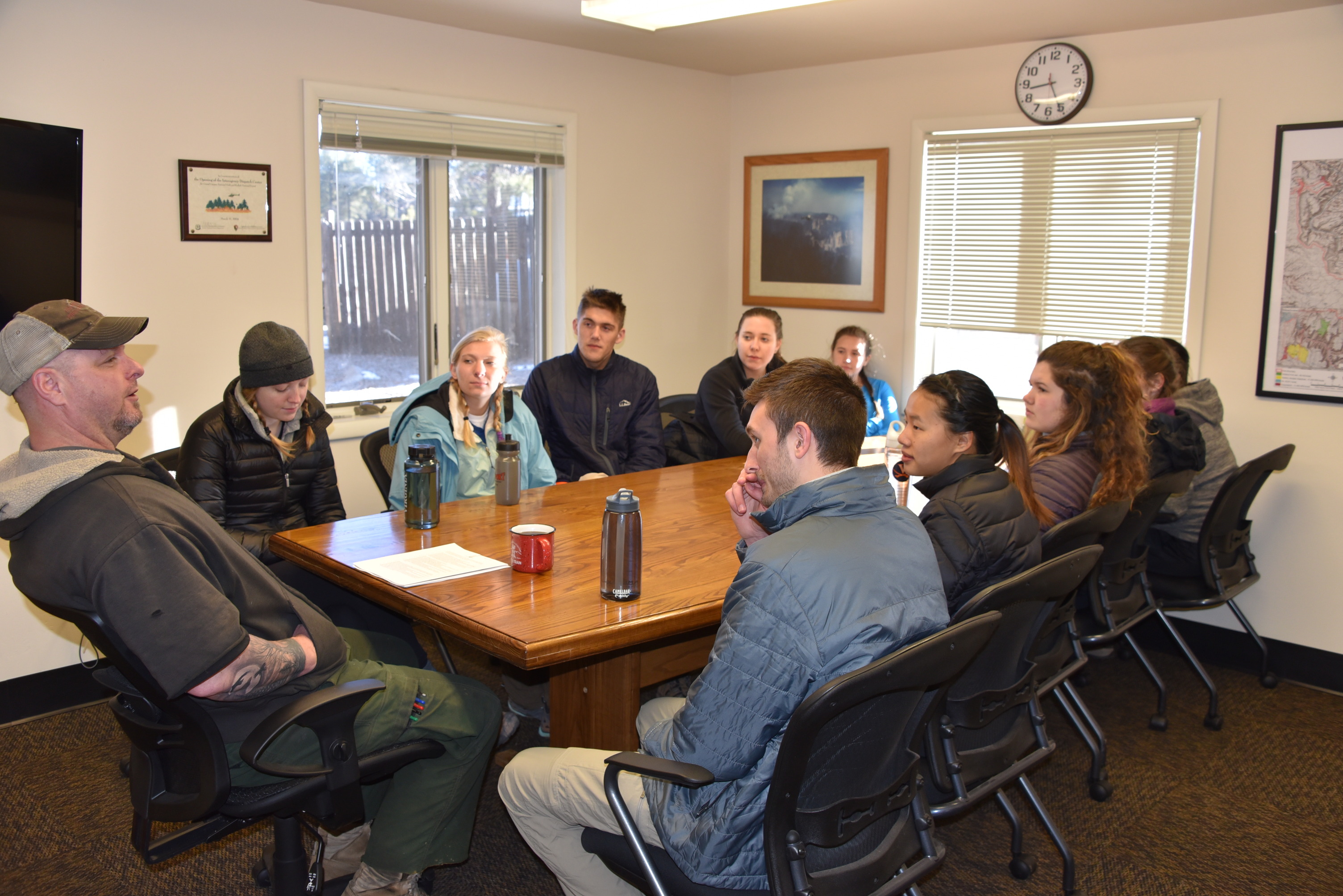 10 students listening to Dan about Wildland Fire.