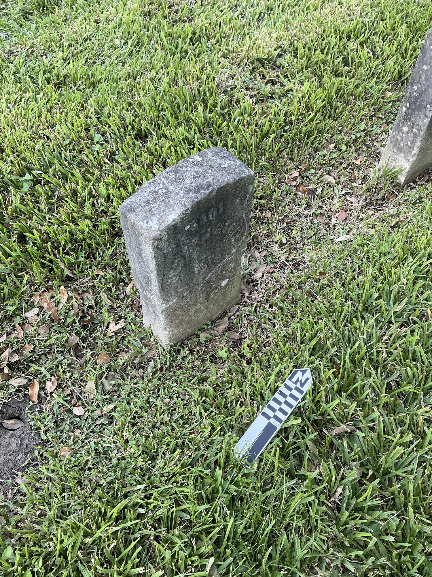 Extra image of historic upright marble headstone with recessed shield face.