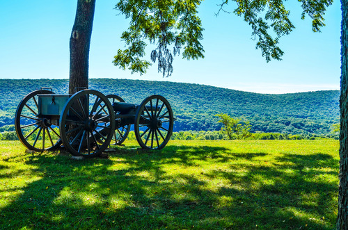 A single cannon along the Bolivar Heights Trail with the Blue Ridge Mountain in the background.