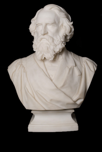 White bust of Henry Longfellow with full beard and mustache, wearing suit and academic robe.