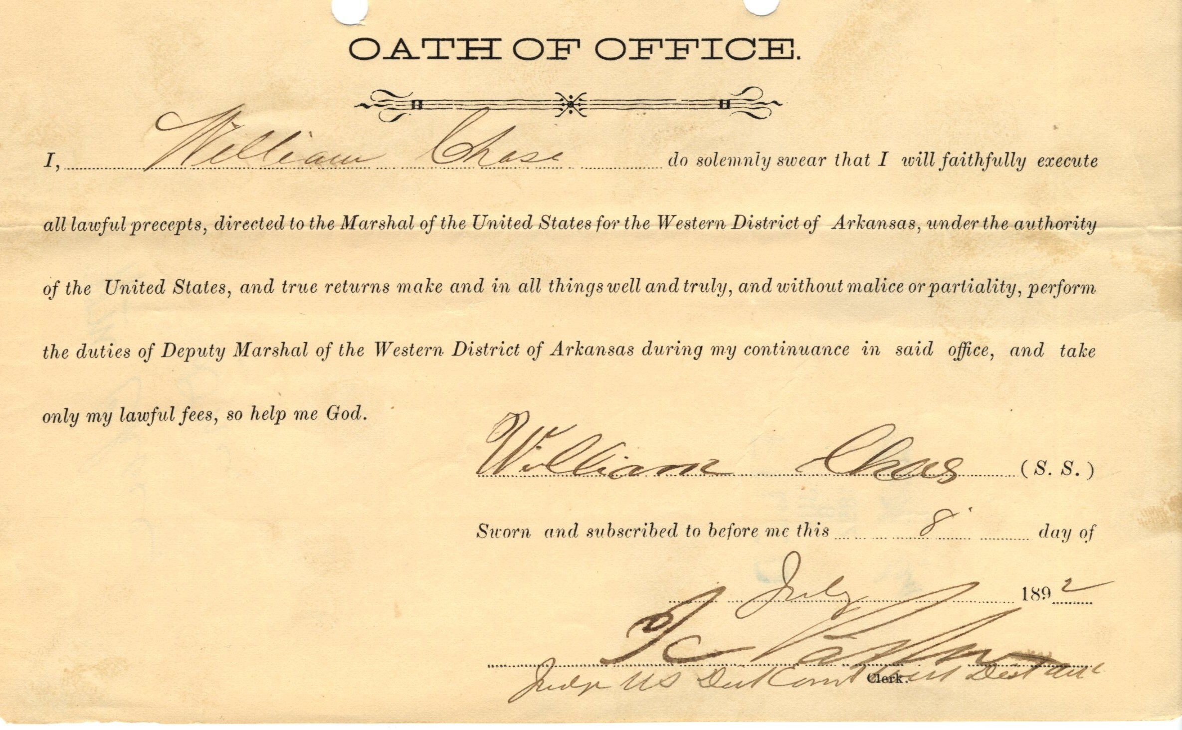 An aged slip of paper titled, "Oath of Office," with the signature of William Chase dated July 8, 1892. Text reads: “I do solemnly swear that I will faithfully execute all lawful precepts, directed to the Marshal of the United States for the Western District of Arkansas, under the authority of the United States, and true returns make and in all things well and truly, and without malice or partiality, perform the duties of Deputy Marshal of the Western District of Arkansas during my continuance in said office, and take only my lawful fees, so help me god.”