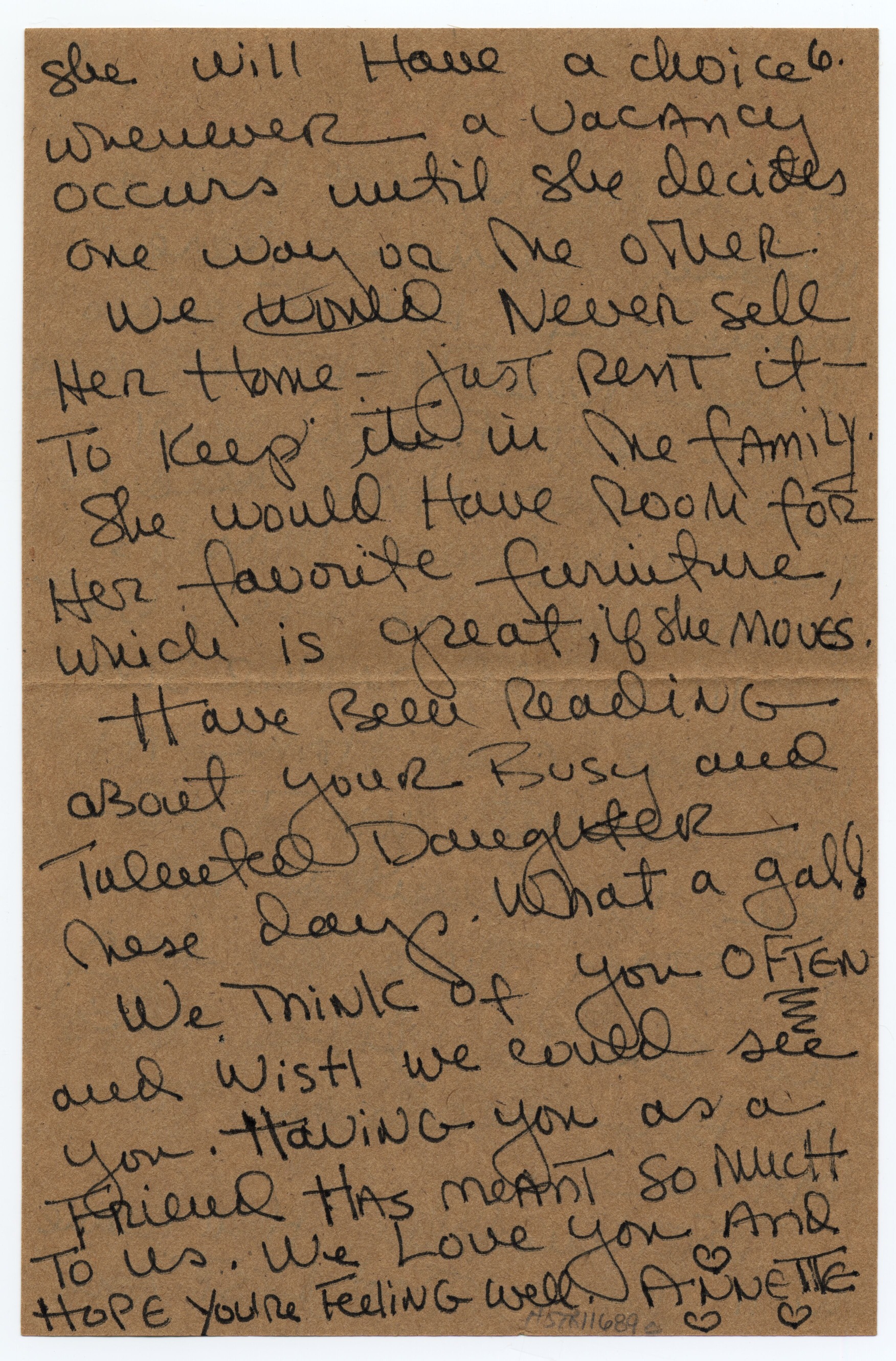 A letter written in black pen on brown stationary.
