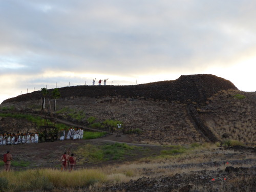 Offering ceremony begins with sun rising behind Pu'ukohola Heiau.