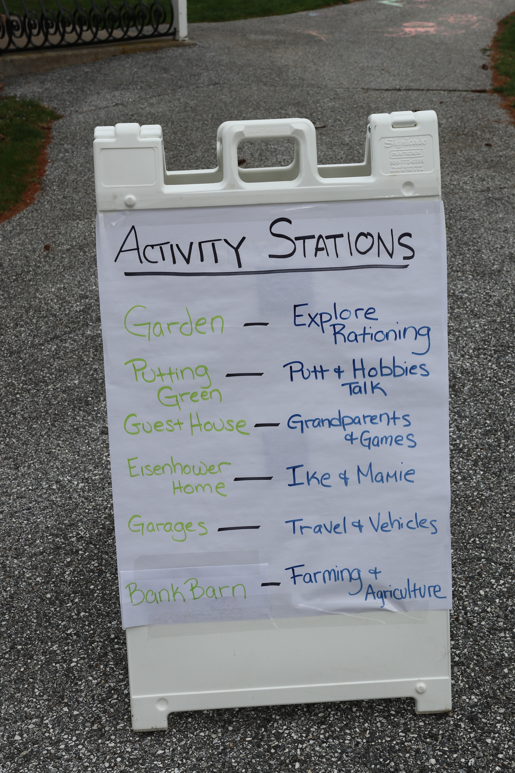 A white sign listing the activities for the Easter Egg Roll