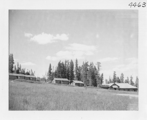Cabins at Cedar Breaks shortly before their destruction, car parked in front.