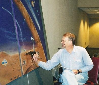 A painter is touching up a painting of a space scene.