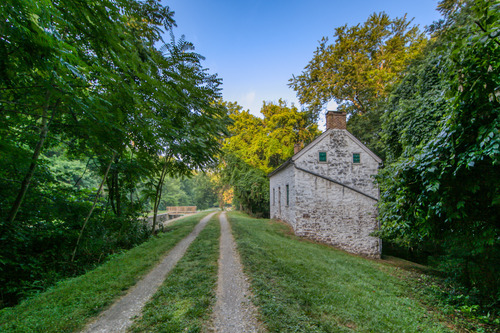 A white building next to a trail