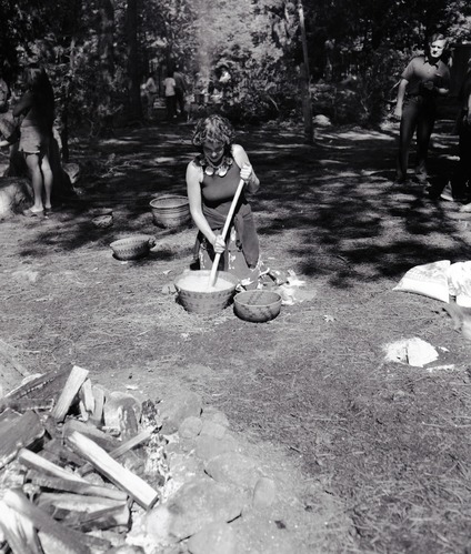 Kim Hamilton, cooking acorn mush at the Roundhouse Dedication, Yosemite Valley. Kim (Apache/Irish) was an employee of the Indian Cultural program.