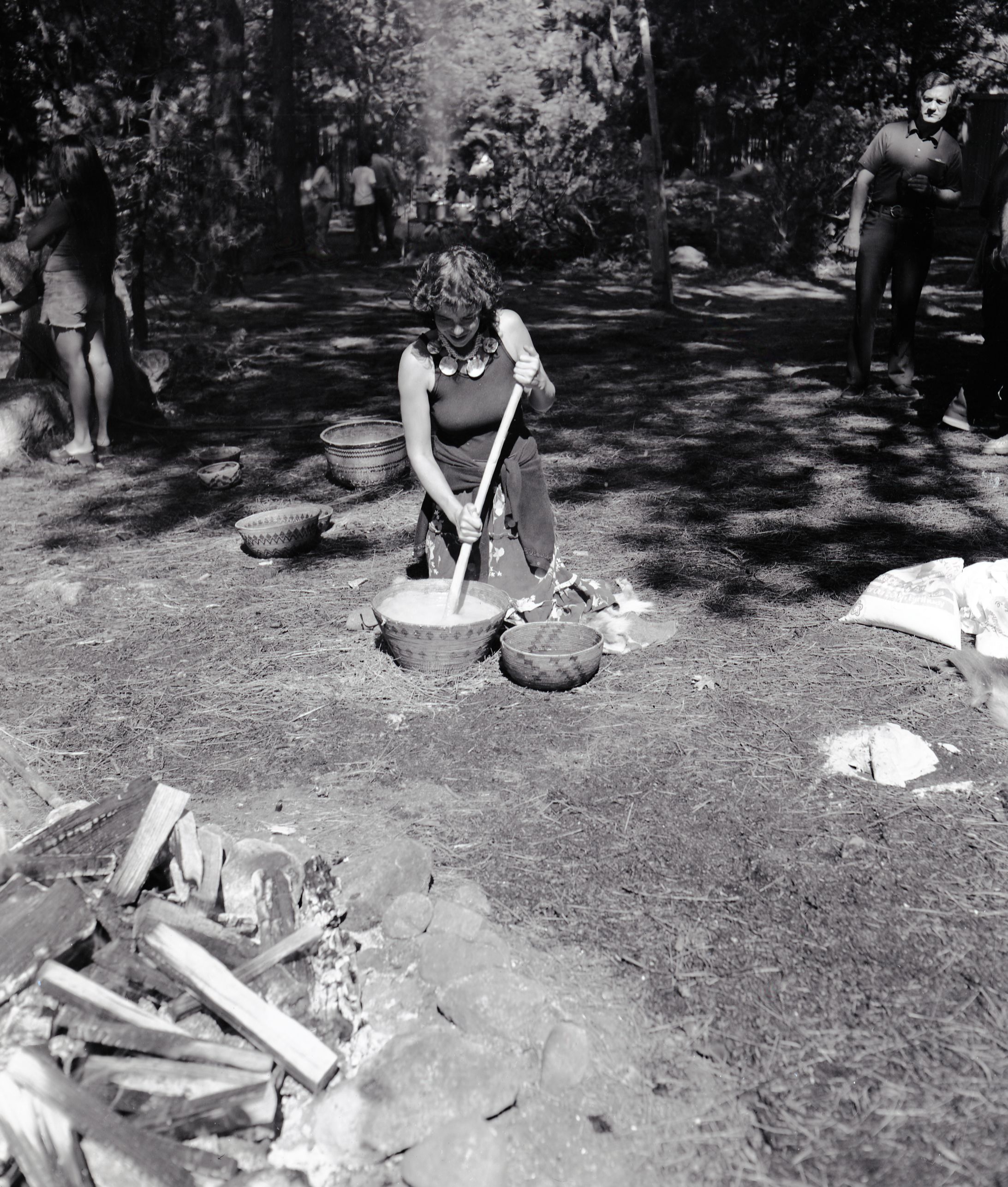 Kim Hamilton, cooking acorn mush at the Roundhouse Dedication, Yosemite Valley. Kim (Apache/Irish) was an employee of the Indian Cultural program.