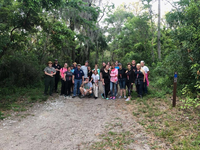 group on trail smiles with ranger 
