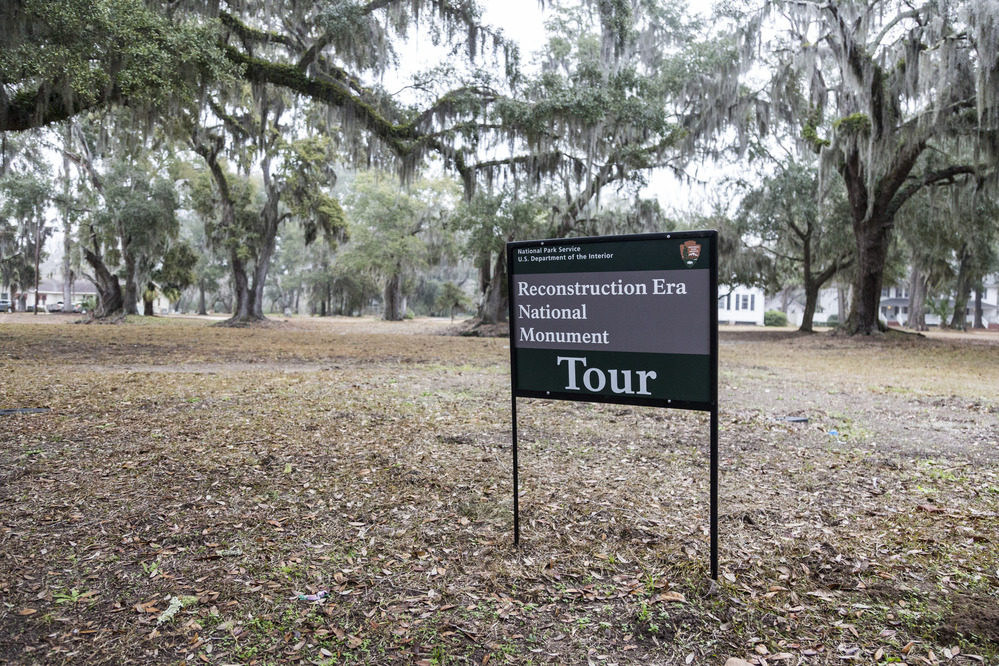 A sign for Reconstruction Era National Monument that says Tour. 