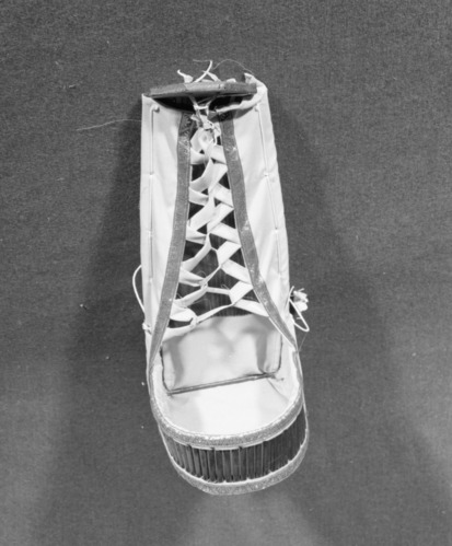 Marie Rozier Collection, Catalog No. 237. Object: Model Apache cradleboard. Dimensions: 18". Materials: plywood, dowels, cotton cloth, commercial woolen braid, varnish. Collection History: Purchased from Fred Harvey store for $14.50. Recent, c. 1973. Photographed by Michael Dixon, December 1982. Catalogued by Craig Bates and Barbara Beroza. Yosemite Collections, National Park Service.