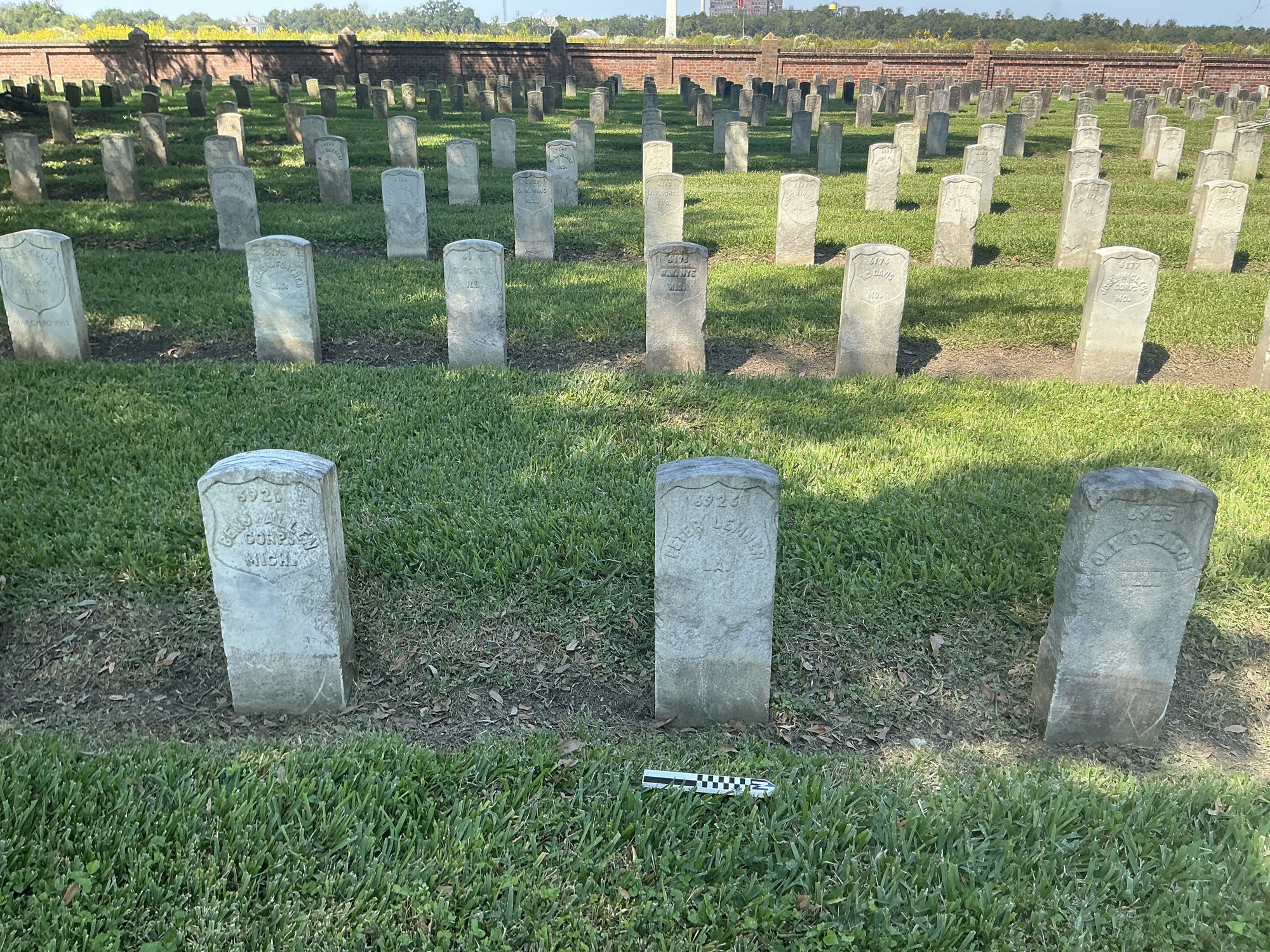 Extra image of historic upright marble headstone with recessed shield face.