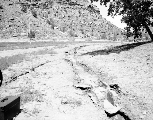 Of flood damage - washed out terrace dam of irrigation system near Visitor Center.