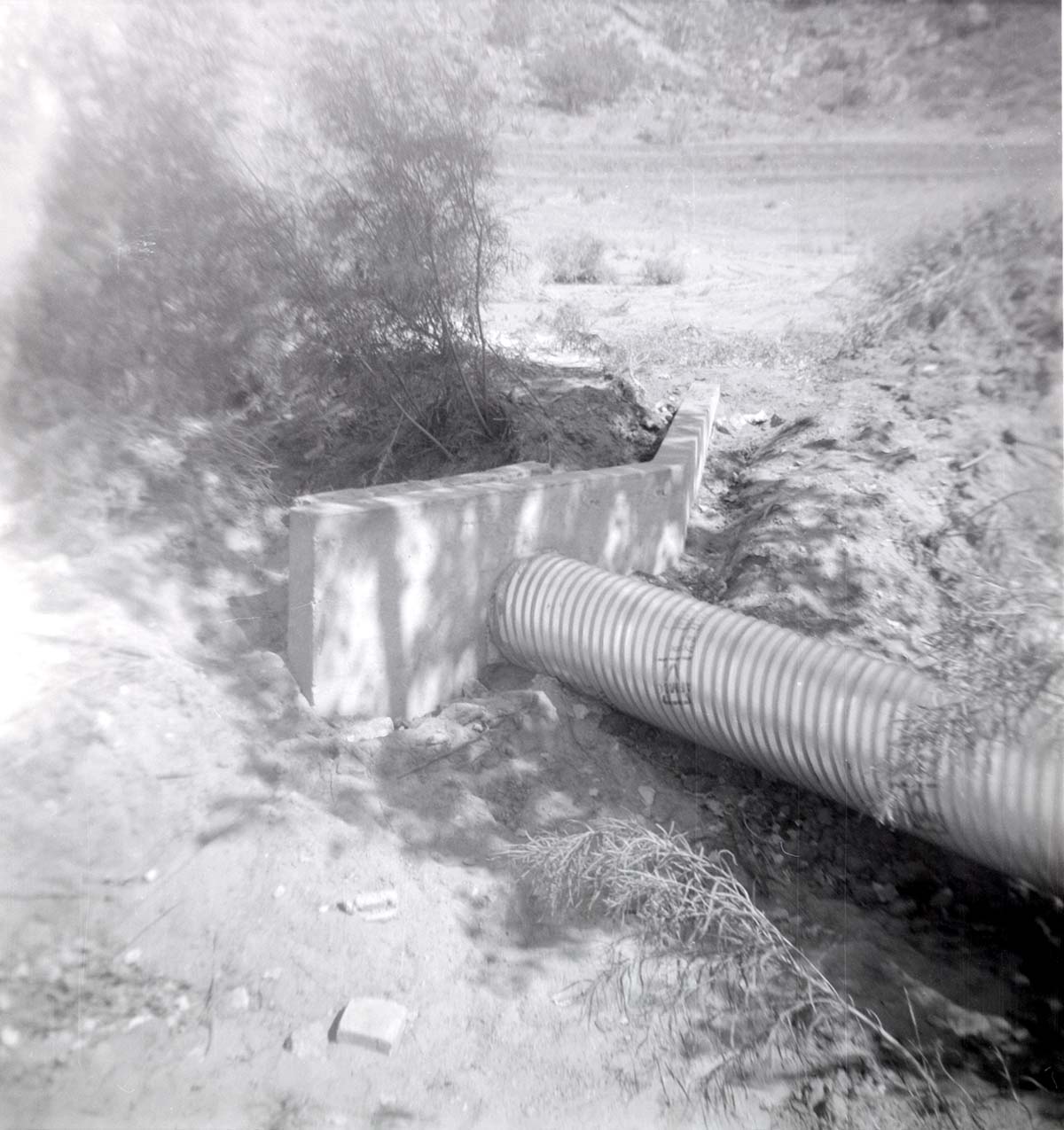 Park personnel installing a culvert/drainage pipe in location in Zion.