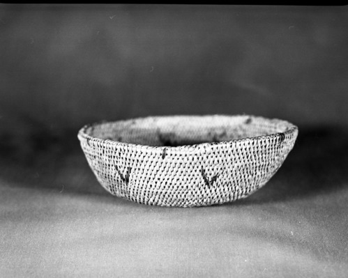 Private Collection. Object: Miwok basket. Dimensions: 7 x 2 1/4". Materials: Split bullpine and redbud. Technology: Clockspring start, overstitched, single rod interlocking, fag ends trimmed on workface, moving ends trmmed on interior. Rim stitched around twice, splitting top coil. Collection History: Made by Matilda, a Sonora Miwok. Photographed by Michael Dixon. Catalogued by Craig Bates and Barbara Beroza. Yosemite Collections, National Park Service.