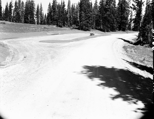 Equipment and gravel piles during construction of a parking area at north view overlook. Record of project.