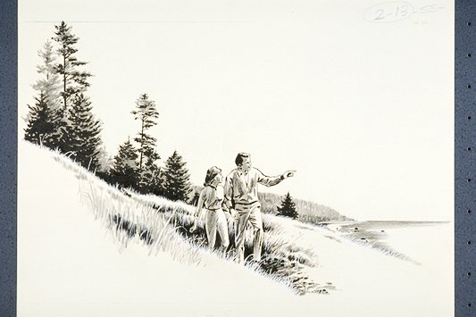 Couple walking along Coastal Trail. Man points out toward the Pacific Ocean.