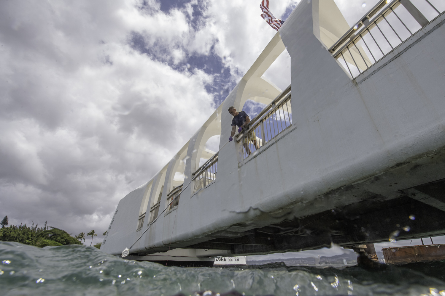 Scientist Chris Reddy collects and analyzes oil samples from the USS Arizona.