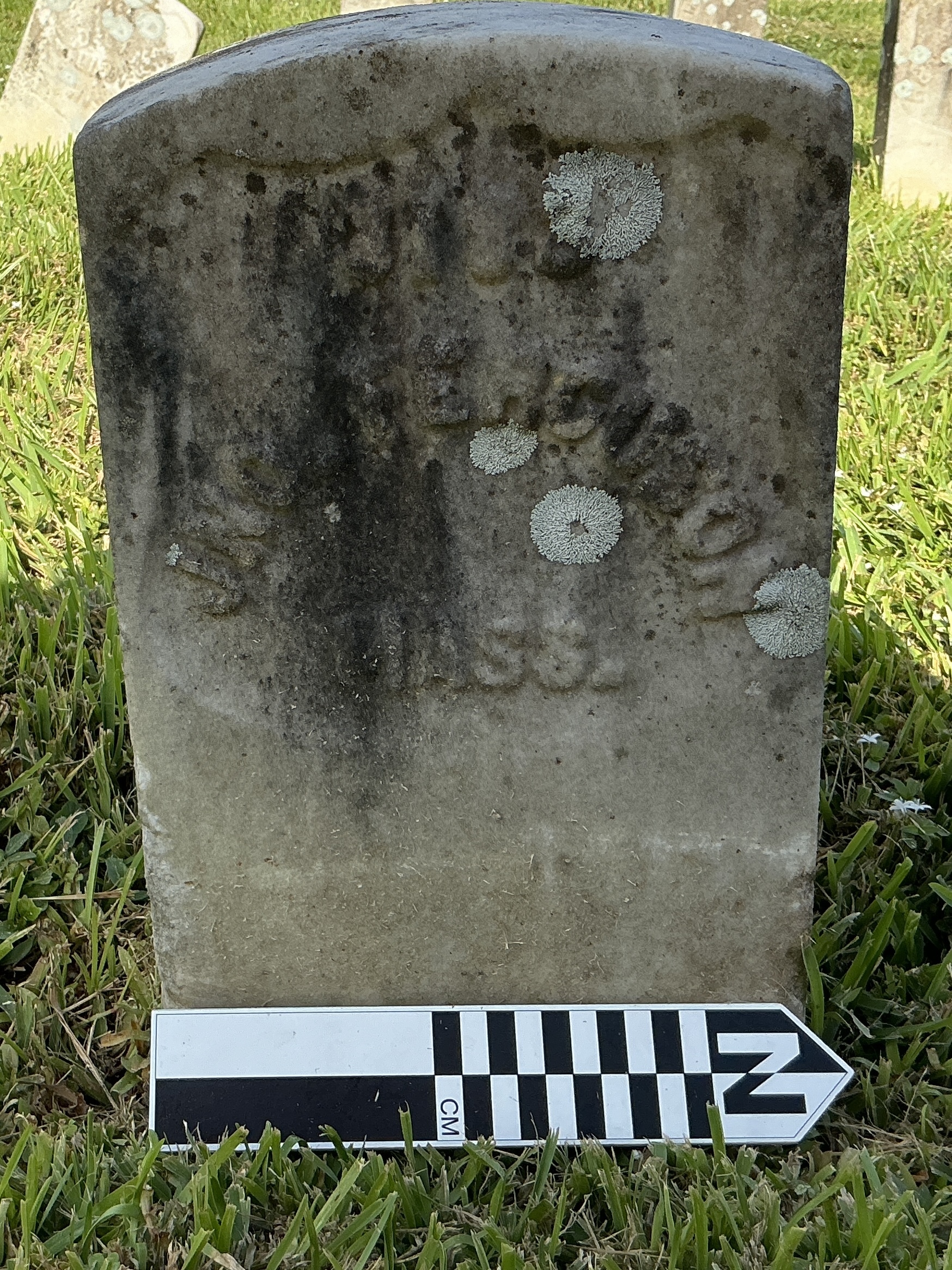 Extra image of historic upright marble headstone with recessed shield face.