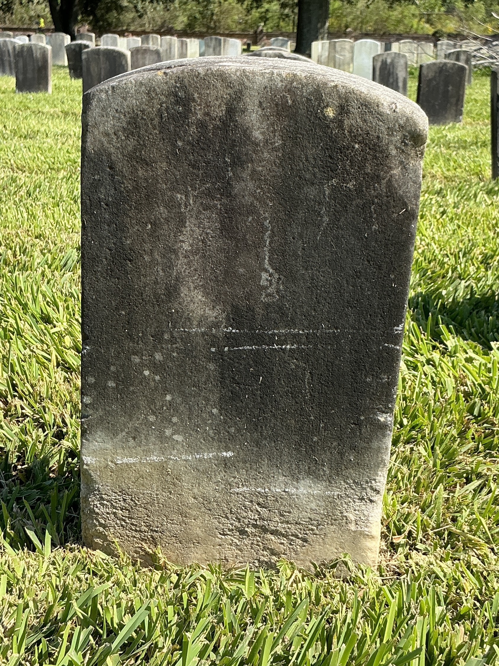 Extra image of historic upright marble headstone with recessed shield face.