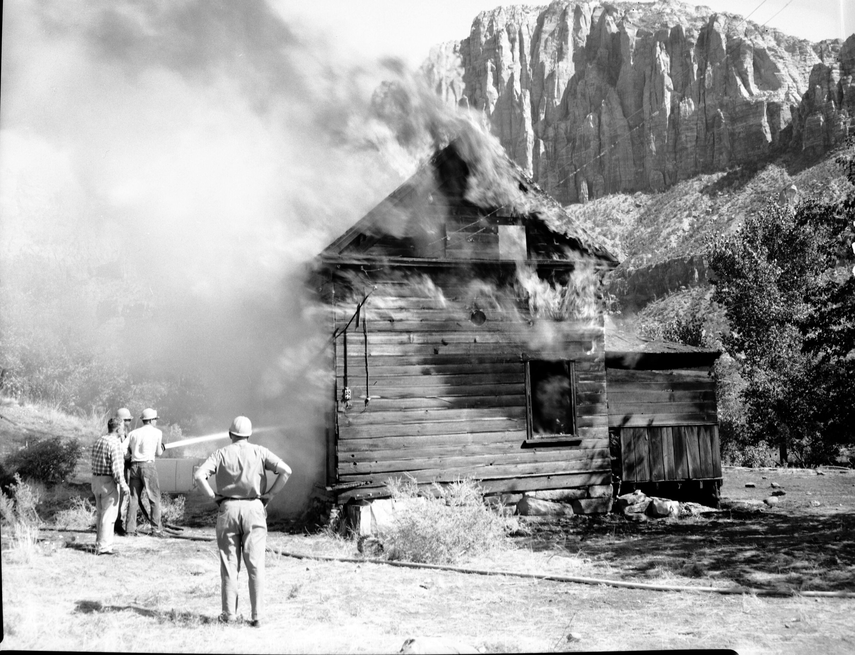 Fire prevention training; demonstration for students of Springdale school. Burning of old Justet home adjacent to Springdale school.