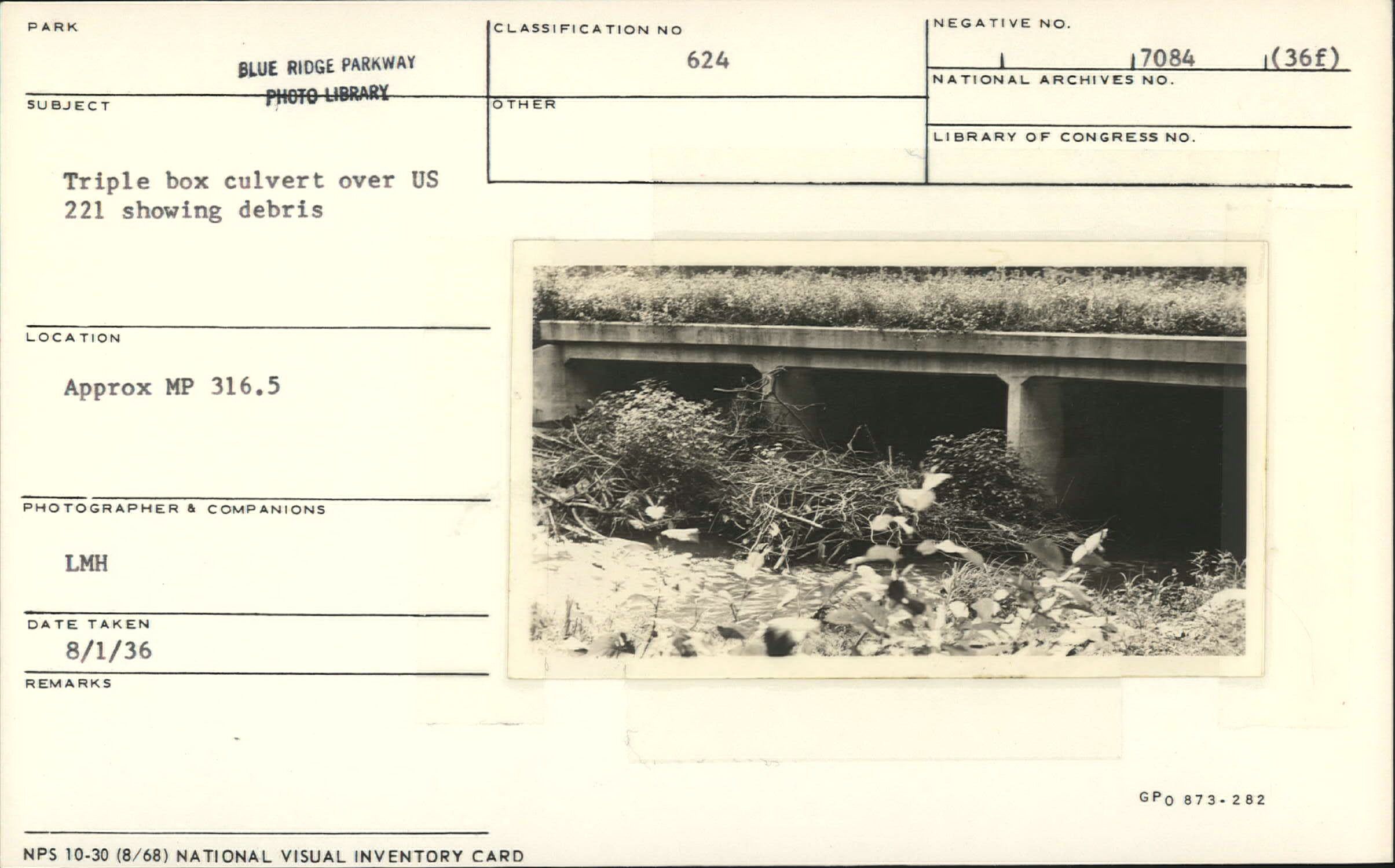 Triple box culvert over US 221 showing debris