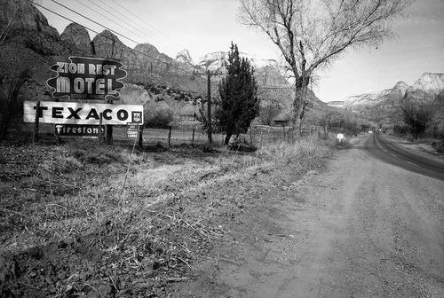 Roadside signs in Springdale. Zion Rest Motel and Texaco signs.