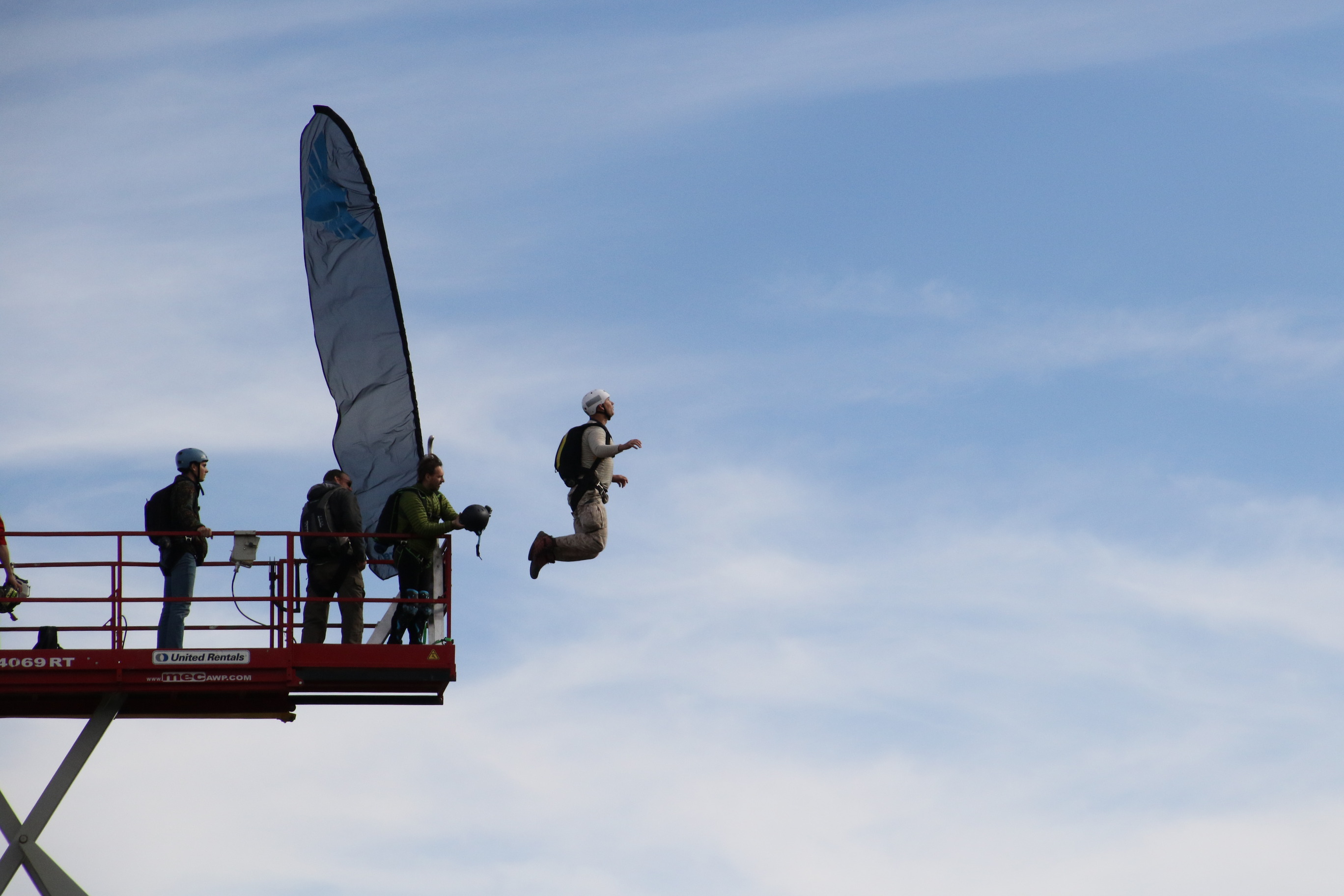 base jumper jumping off platform into the air