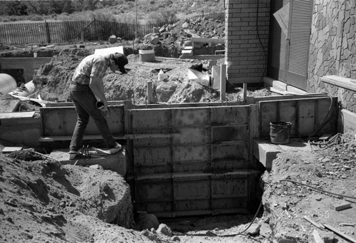 Man worker during construction of headquarters addition.