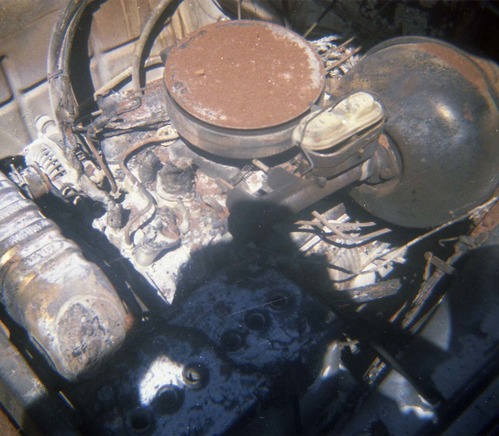 Color photo of an engine fire in a pickup.