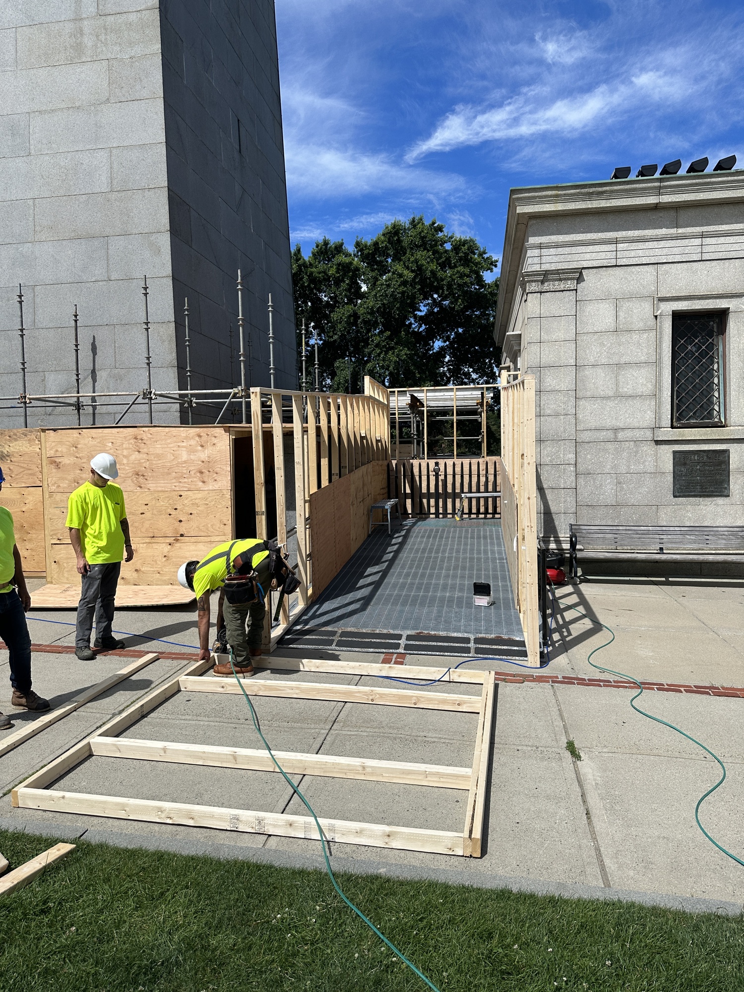 Contractors building a pedestrian pathway sup a ramp to the Bunker Hill Lodge. 