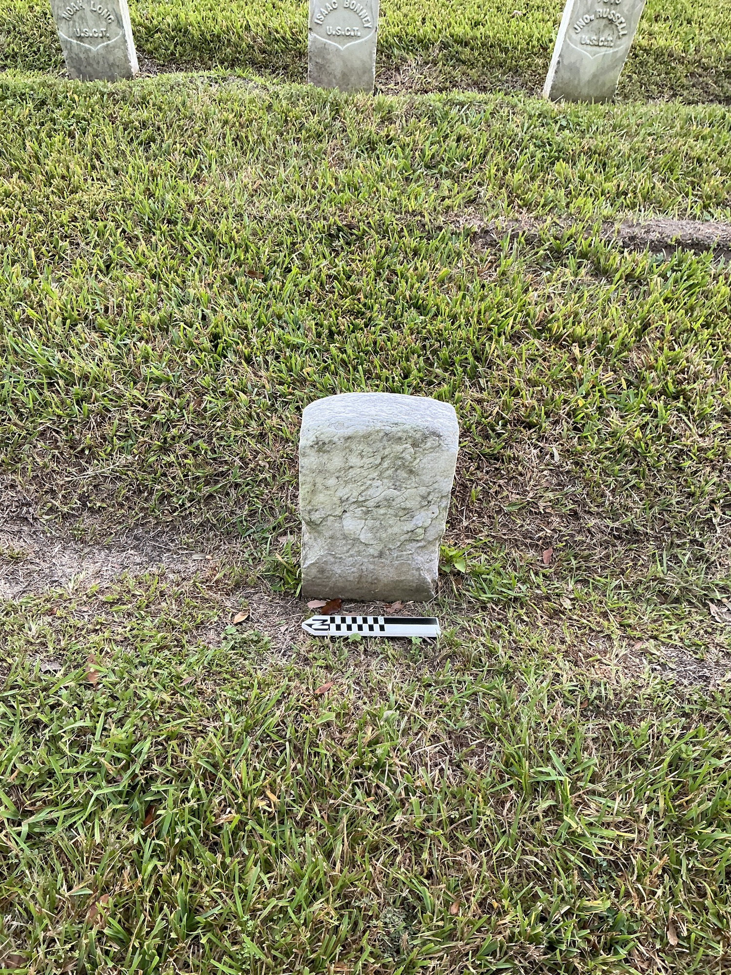 Extra image of historic upright marble headstone with recessed shield face.