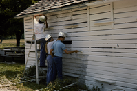 HFCA 1607_Fires And Firefighting_115.jpg. Fires and Firefighting. Three teenagers in the Youth Conservation Corps work on painting a building at Gettysburg National Military Park.