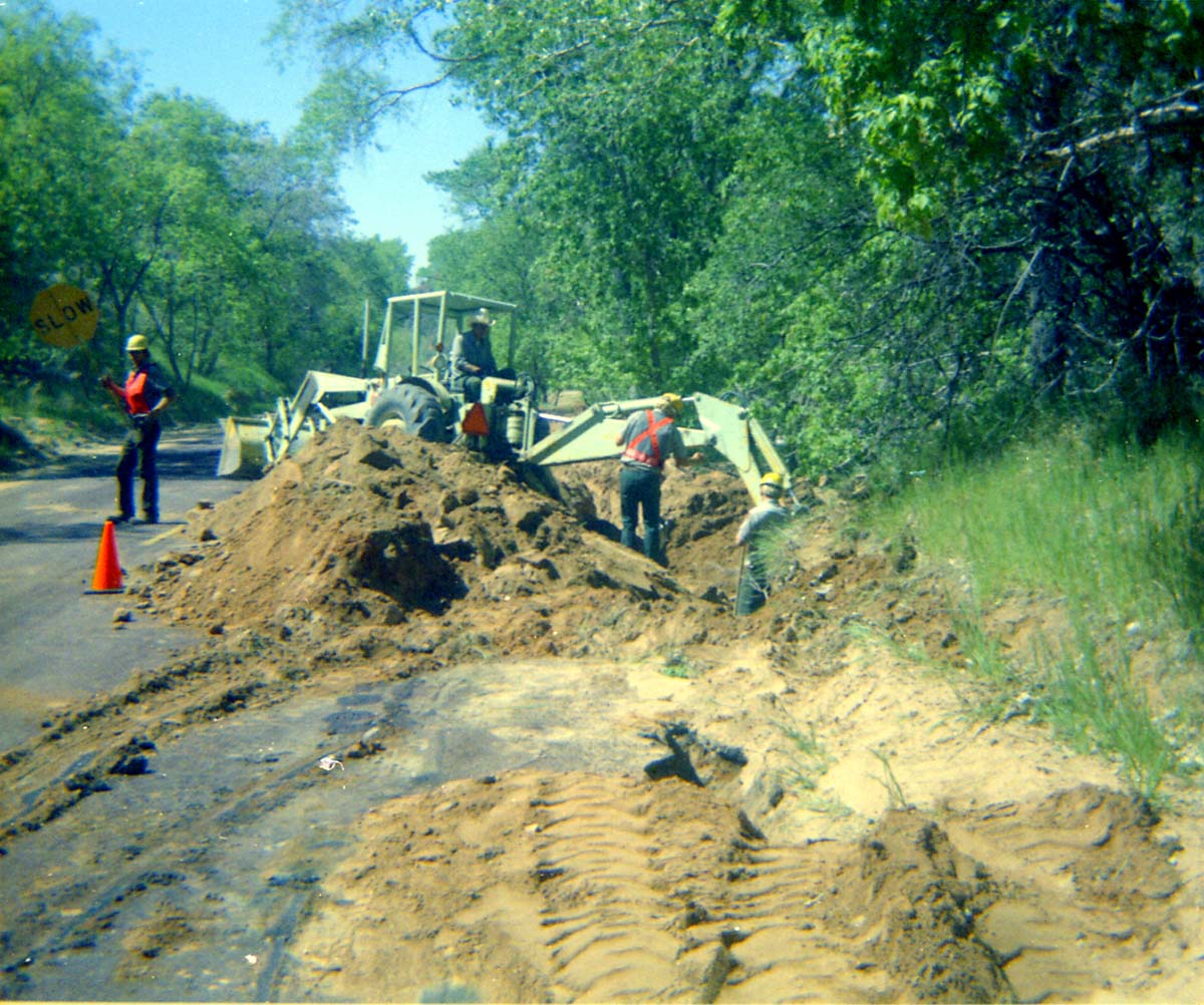 Construction vehicles and workers during the Zion Lodge utilities project.