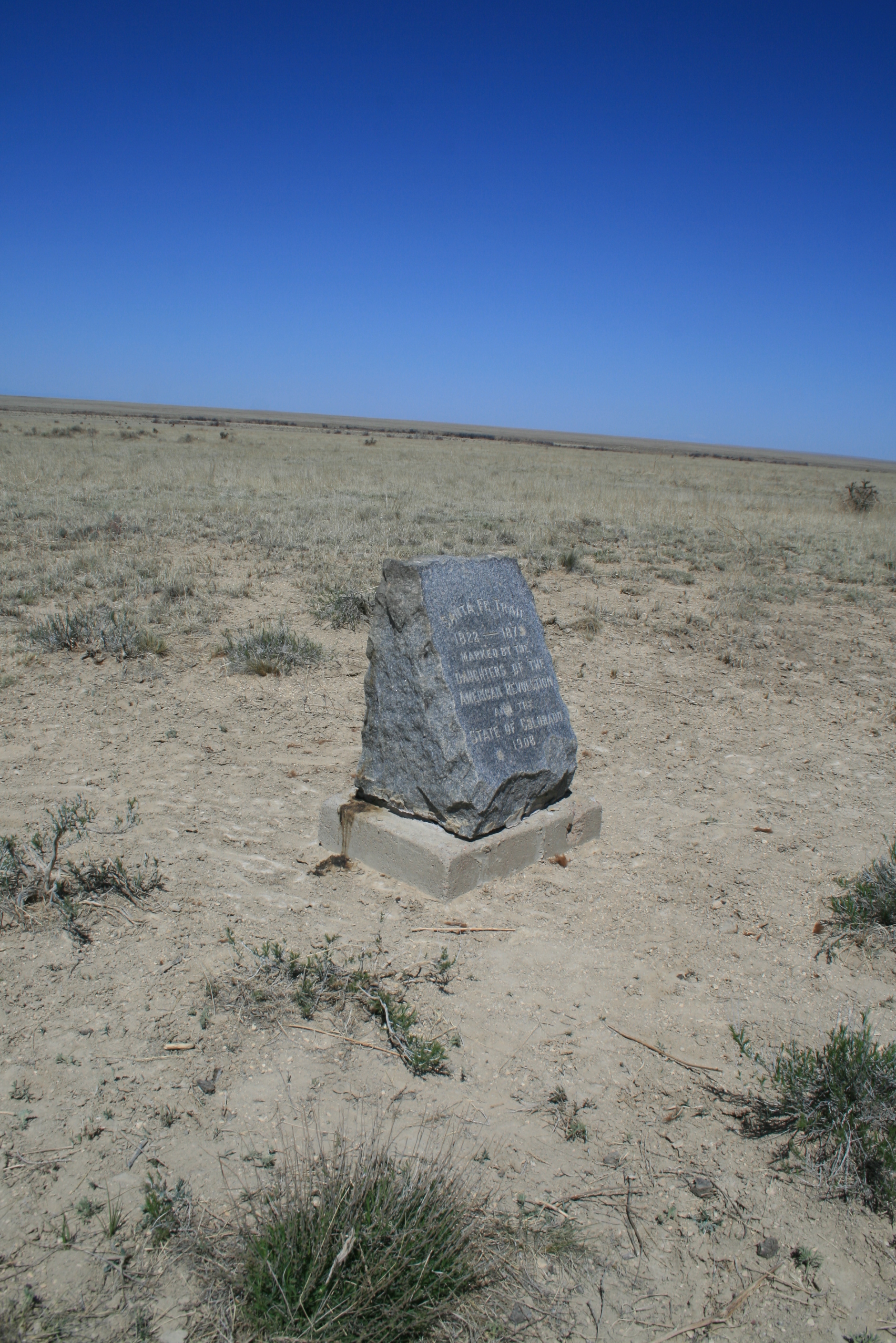 A marker on the dry prairie in LaJunta, CO shows livestock impacts