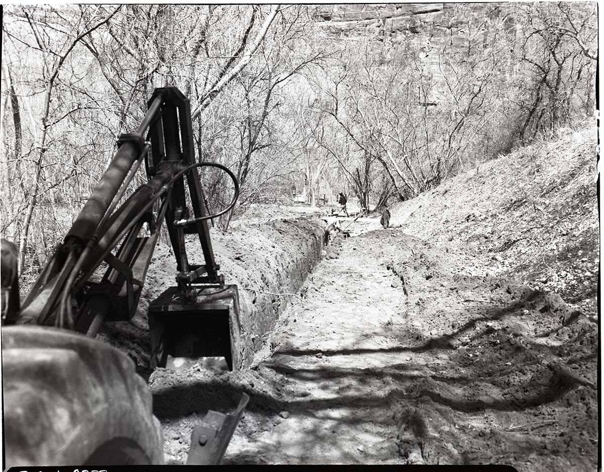 Ditch digging at Grotto Campground for sewage disposal system.