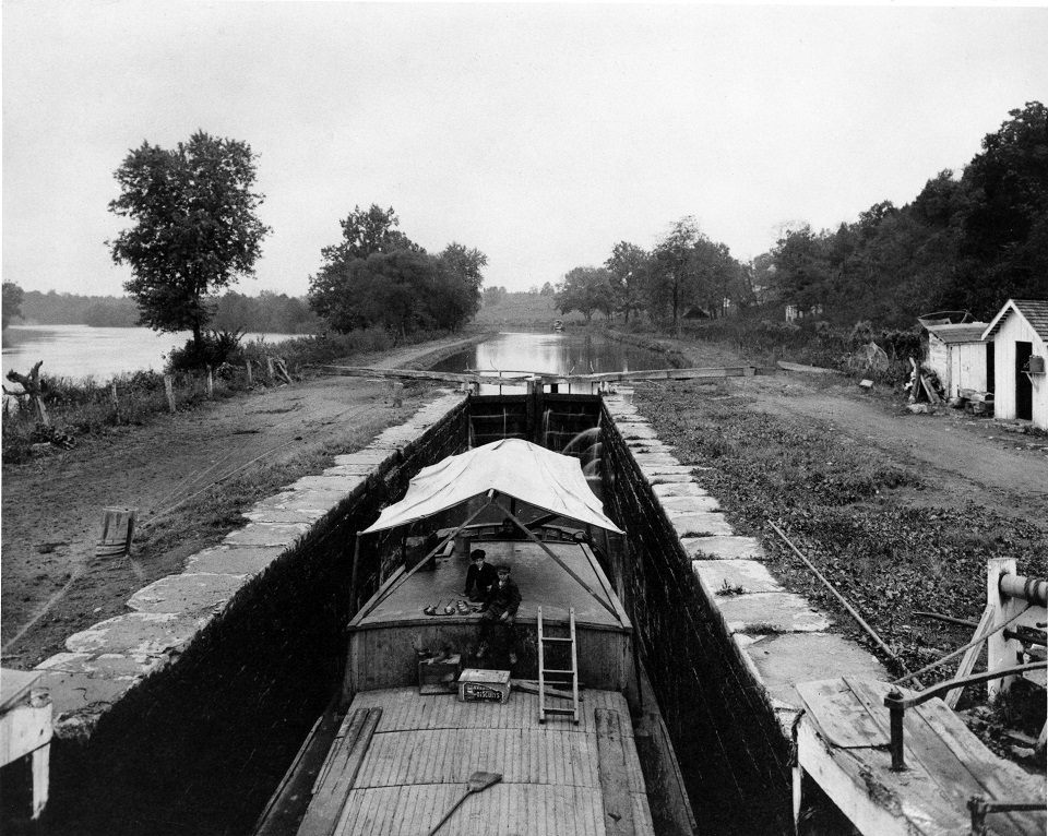 Historical phot of two boys sitting on a canal boat in Lock 2.